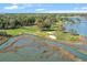 Aerial view of golf course, marsh, and surrounding trees at 9547 Edgerton Dr. # 606, Myrtle Beach, SC 29572