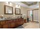 Bathroom featuring double sinks with granite countertops and a glass-enclosed shower at 9547 Edgerton Dr. # 606, Myrtle Beach, SC 29572