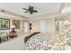 Bedroom with a floral bedspread and a doorway that leads to a bath at 9547 Edgerton Dr. # 606, Myrtle Beach, SC 29572