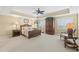 Bedroom with a floral bedspread, matching bedside lamps, and decorative fan at 9547 Edgerton Dr. # 606, Myrtle Beach, SC 29572