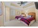 Bedroom with two twin beds, a ceiling fan, neutral walls and carpeting at 9547 Edgerton Dr. # 606, Myrtle Beach, SC 29572