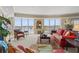 Bright living room with floor to ceiling windows with beautiful view and plush seating at 9547 Edgerton Dr. # 606, Myrtle Beach, SC 29572