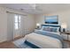 Bedroom with a blue bedspread and ocean-themed art at 9594 Sullivan Dr., Murrells Inlet, SC 29576