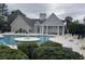 Community pool with lounge chairs and clubhouse at 9764 Leyland Dr. # 7, Myrtle Beach, SC 29572