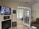 Living room with fireplace and French doors leading to sunroom at 9764 Leyland Dr. # 7, Myrtle Beach, SC 29572