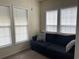 Bright sunroom features a comfortable couch and large windows at 9764 Leyland Dr. # 7, Myrtle Beach, SC 29572