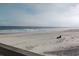 Scenic beach view with calm waves and a person relaxing at 1 Norris Dr. # 219, Pawleys Island, SC 29585