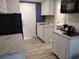 Compact kitchen with white cabinets and modern appliances at 1 Norris Dr. # 219, Pawleys Island, SC 29585