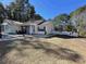 House exterior with a metal roof and landscaped yard at 1044 Chateau Dr., Conway, SC 29526