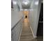 Bright hallway with wood-look flooring and decorative wall at 1044 Chateau Dr., Conway, SC 29526