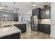 Modern kitchen with dark cabinetry, granite countertops and stainless steel appliances at 1112 Marsh View Dr., North Myrtle Beach, SC 29582