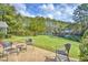 Spacious backyard with patio, pond view, and lush landscaping at 113 Knight Circle # 2, Pawleys Island, SC 29585
