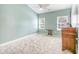 Light-filled bedroom with neutral walls and carpet flooring at 113 Knight Circle # 2, Pawleys Island, SC 29585