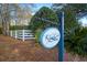 Kings Creek community entrance sign with white fence and landscaping at 113 Knight Circle # 2, Pawleys Island, SC 29585