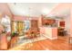 Open dining room with hardwood floors and a view into the kitchen at 113 Knight Circle # 2, Pawleys Island, SC 29585