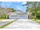 Two-car garage with a long driveway and mature trees at 113 Knight Circle # 2, Pawleys Island, SC 29585