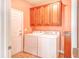 Laundry room with washer, dryer, cabinets, and exterior access at 113 Knight Circle # 2, Pawleys Island, SC 29585