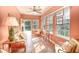 Bright sunroom with tiled floors, comfy seating, and access to backyard at 113 Knight Circle # 2, Pawleys Island, SC 29585