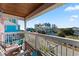 Balcony with partial ocean view and outdoor seating at 118 Seabreeze Dr., Murrells Inlet, SC 29576