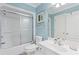 Light blue bathroom with shower/tub combo and vanity at 118 Seabreeze Dr., Murrells Inlet, SC 29576