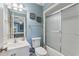 Light blue bathroom with shower/tub combo and vanity at 118 Seabreeze Dr., Murrells Inlet, SC 29576