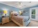 Bright bedroom with a queen bed and private balcony access at 118 Seabreeze Dr., Murrells Inlet, SC 29576