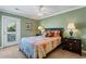 Cozy bedroom with a comfortable bed and access to a private balcony at 118 Seabreeze Dr., Murrells Inlet, SC 29576