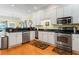 Modern kitchen with white cabinets, stainless steel appliances, and granite countertops at 118 Seabreeze Dr., Murrells Inlet, SC 29576