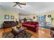 Open living room and kitchen with hardwood floors and ample natural light at 118 Seabreeze Dr., Murrells Inlet, SC 29576