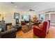 Spacious living room with hardwood floors, comfortable seating, and large TV at 118 Seabreeze Dr., Murrells Inlet, SC 29576
