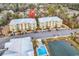 Aerial view of two-story building with pool and parking at 130 Puffin Dr. # 3-E, Pawleys Island, SC 29585