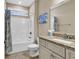 Bathroom with tub, shower, granite countertop, and updated vanity at 130 Puffin Dr. # 3-E, Pawleys Island, SC 29585