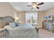 Bedroom with a queen bed, dresser, and coastal-themed TV at 130 Puffin Dr. # 3-E, Pawleys Island, SC 29585