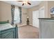 Light and airy bedroom with a twin bed, window, and ceiling fan at 130 Puffin Dr. # 3-E, Pawleys Island, SC 29585