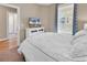 Bedroom with a queen bed, dresser, and TV at 130 Puffin Dr. # 3-E, Pawleys Island, SC 29585