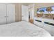 Bedroom with a queen bed, dresser, and view of dining area at 130 Puffin Dr. # 3-E, Pawleys Island, SC 29585