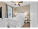 Bedroom with a queen bed, nightstands, and ceiling fan at 130 Puffin Dr. # 3-E, Pawleys Island, SC 29585