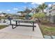 Community grilling area with picnic tables and pond view at 130 Puffin Dr. # 3-E, Pawleys Island, SC 29585