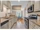Modern kitchen with granite countertops and stainless steel appliances at 130 Puffin Dr. # 3-E, Pawleys Island, SC 29585
