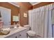 Bathroom featuring white vanity and a shower with a patterned white curtain at 1501 Brighton Ln., Longs, SC 29568