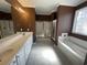 Bathroom with double vanity, walk-in shower, soaking tub, and white tile flooring at 1501 Brighton Ln., Longs, SC 29568
