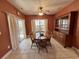 Eat-in kitchen with tile floors, ceiling fan, and sliding glass doors leading to a patio at 1501 Brighton Ln., Longs, SC 29568