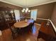 Traditional dining room with wood floors, chandelier, and classic furnishings at 1501 Brighton Ln., Longs, SC 29568