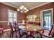 Formal dining room with a decorative chandelier and hardwood floors at 1501 Brighton Ln., Longs, SC 29568