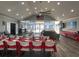 The clubhouse space includes tables, chairs, and an American flag, ideal for community events at 1501 Brighton Ln., Longs, SC 29568