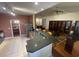 Contemporary kitchen boasts a breakfast bar, stainless steel appliances, seamlessly connected to living and dining areas at 1501 Brighton Ln., Longs, SC 29568
