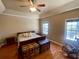 Bedroom featuring hardwood floors, a ceiling fan, and natural light from the windows at 1501 Brighton Ln., Longs, SC 29568