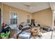 Covered patio featuring comfortable seating around a stone fire pit at 1501 Brighton Ln., Longs, SC 29568