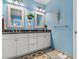 Light and airy bathroom with double vanity, granite countertop, and blue walls at 1511 25Th Ave. N, North Myrtle Beach, SC 29582