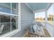 Relaxing porch swing on a covered porch overlooking a neighborhood at 1757 Tryon Dr, Myrtle Beach, SC 29588